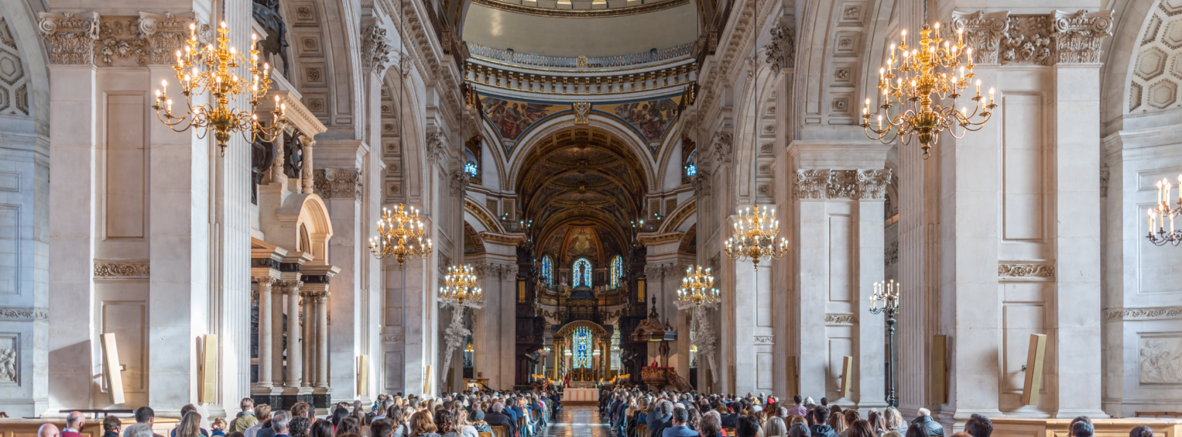 Busy service at St Paul's Cathedral with a view down the nave