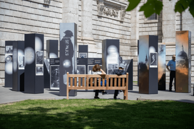 A wide shot of the new exhibition, with a bench in the foreground.