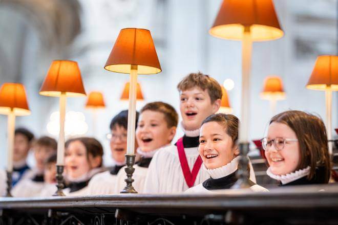 Boy and girl choristers singing in the quire