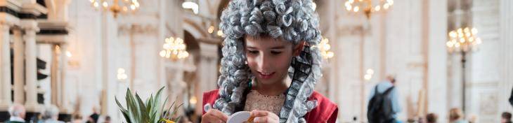 child dressed as Christopher Wren doing craft activities