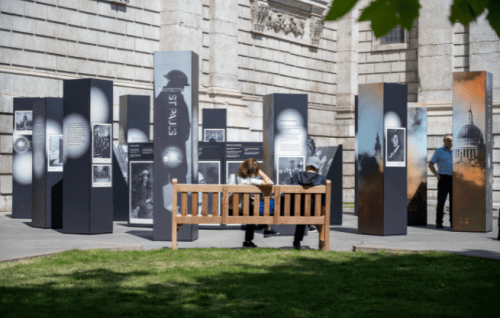 A wide shot of the new exhibition, with a bench in the foreground.