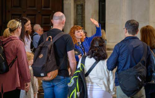 Emily, a member of the Learning team, leads a tour group.